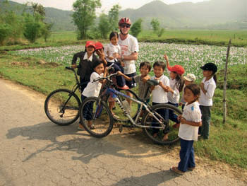 Cyclist With Children Near  Hue  Credit  Exodus