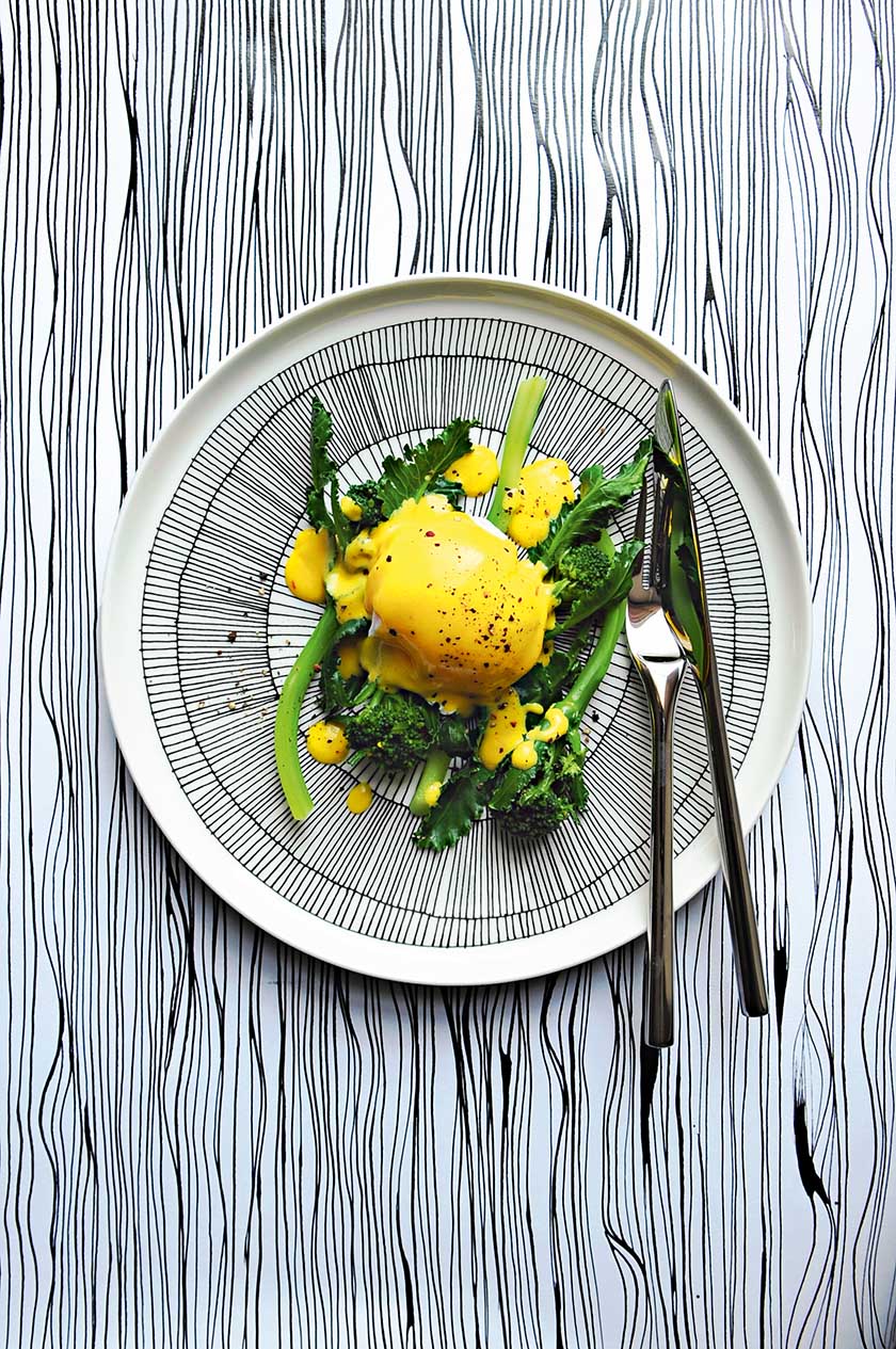 Purple sprouting broccoli with poached duck egg and saffron hollandaise