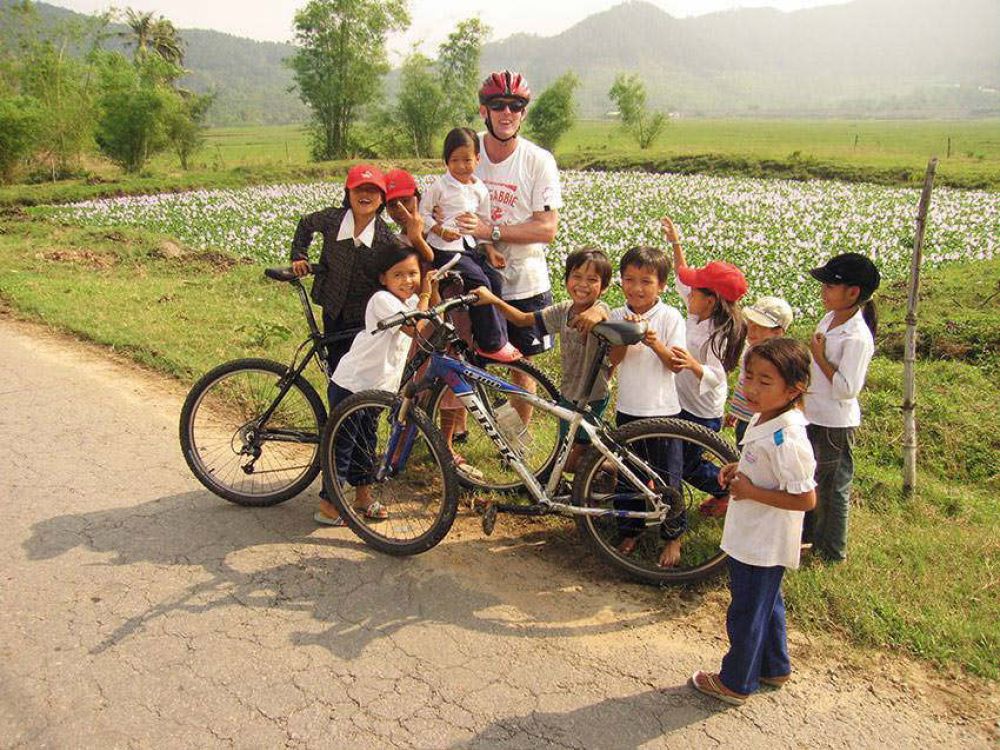 Cyclist With Children Near  Hue  Credit  Exodus
