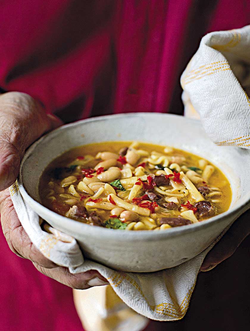 Vegetable and pasta soup with pesto and parmesan