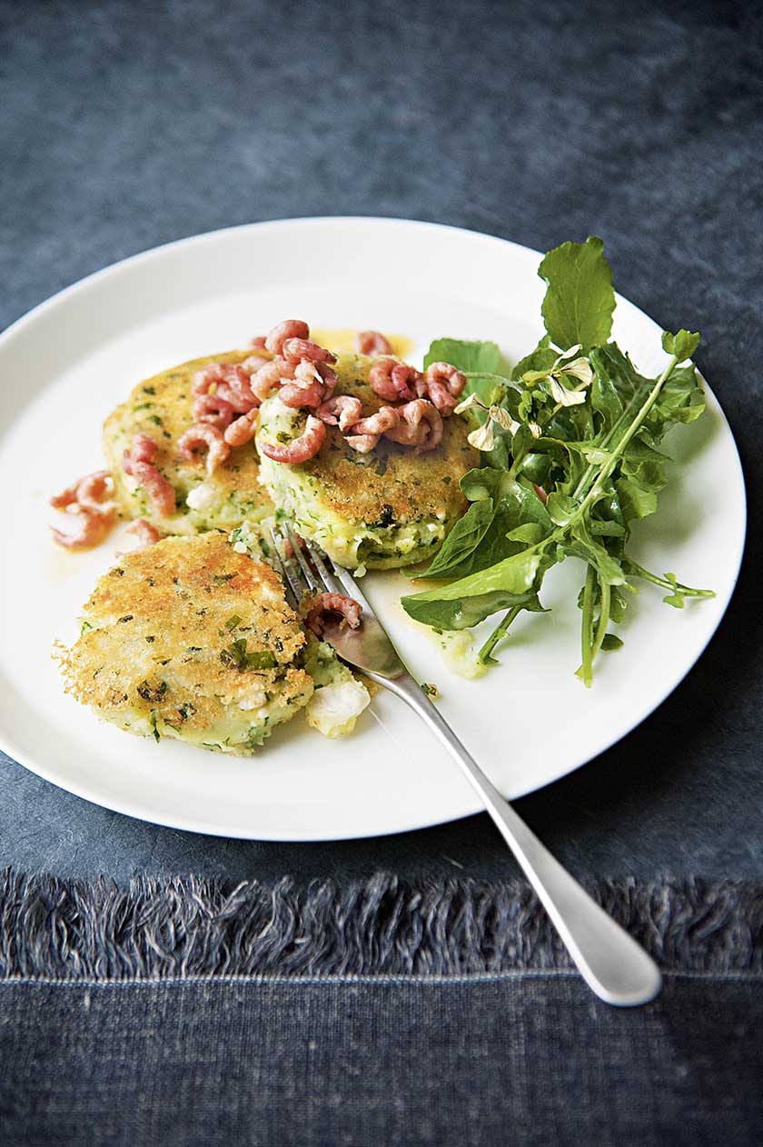 Rocket and potato cakes with buttered shrimp