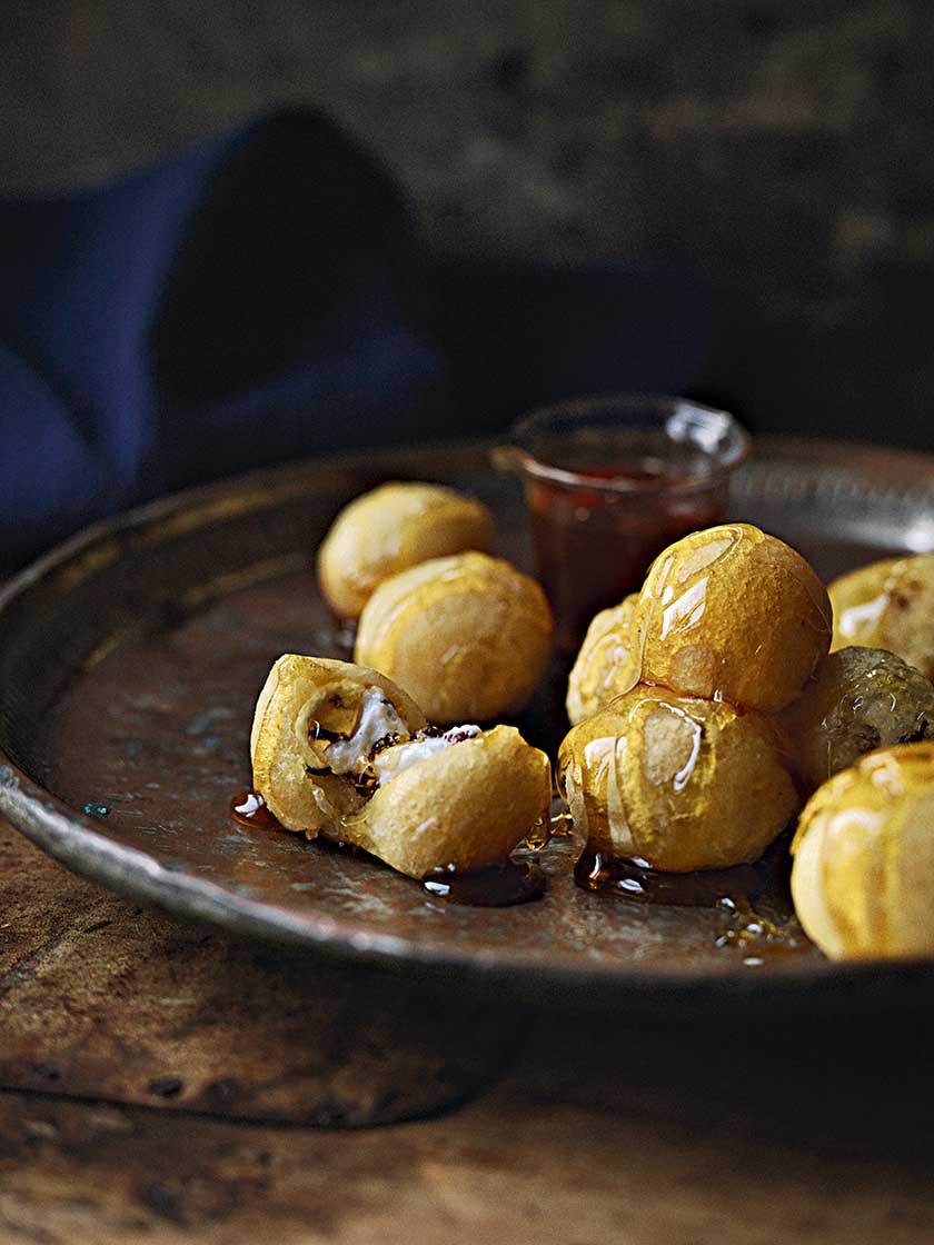 Pistachio and barberry nougat doughnuts with orange blossom syrup