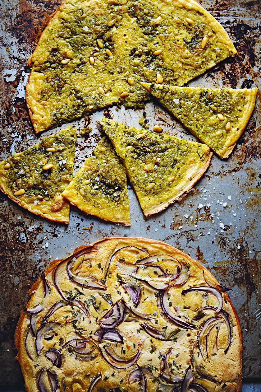 Farinatas (gram flour pancakes) with pesto and sea salt and rosemary and red onions