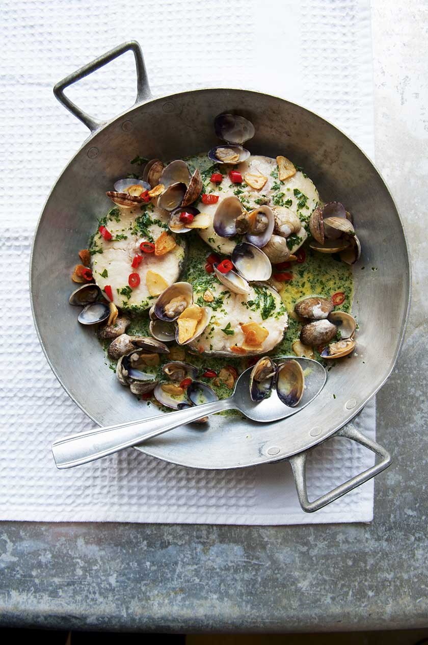 Hake steaks in green sauce with clams