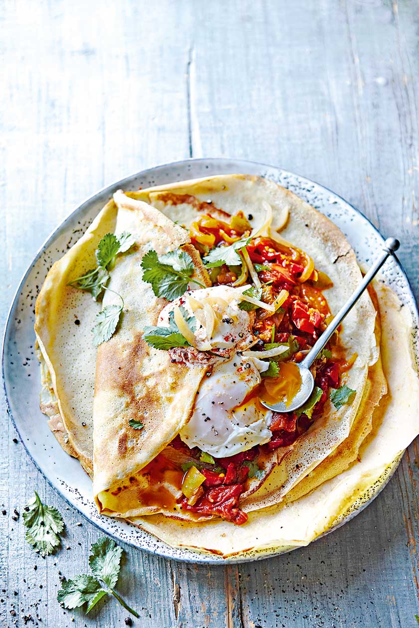 Shakshuka quinoa and buckwheat pancakes with eggs and harissa yoghurt