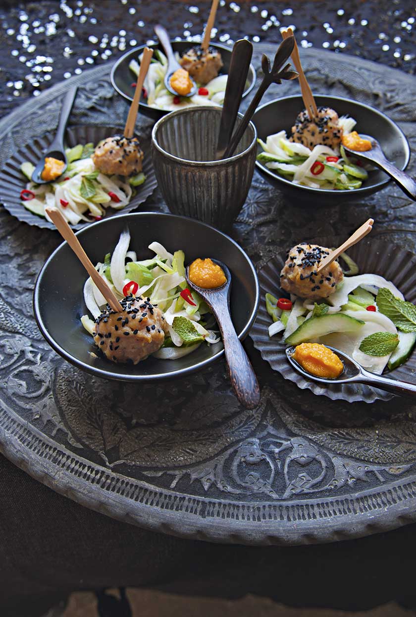 White miso and black sesame chicken balls with fennel and cucumber salad and carrot dressing