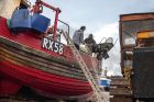 30 Fishermen in hastings checking nets