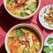 Herby chicken bone broth with rice and onions
