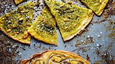 Farinatas (gram flour pancakes) with pesto and sea salt and rosemary and red onions