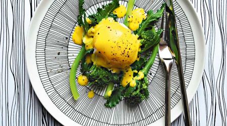 Purple sprouting broccoli with poached duck egg and saffron hollandaise