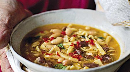 Vegetable and pasta soup with pesto and parmesan