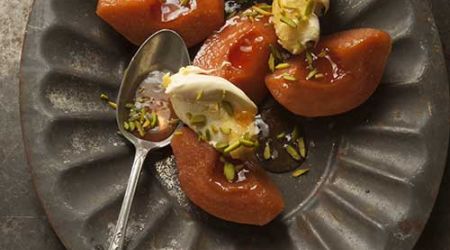 Poached quince with clotted cream and pistachio nibs