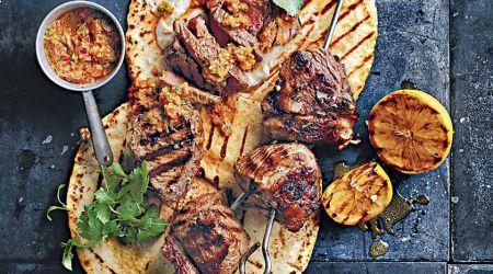 Grilled beef skewers with red chimichurri