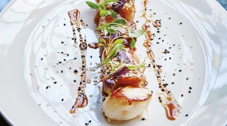 Seared scallops with sesame pork, XO dressing and shiso
