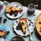 Saffron and bay custard tart with sticky blackberries