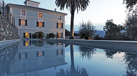 Aethos corsica hotel view pool night hero shot